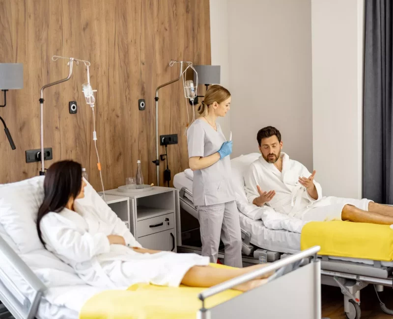 A nurse with a patient in a medical ward