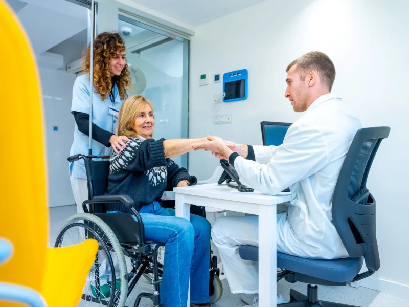 A receptionist booking an appointment for a patient