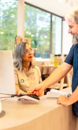 A pharmacist talking with a customer