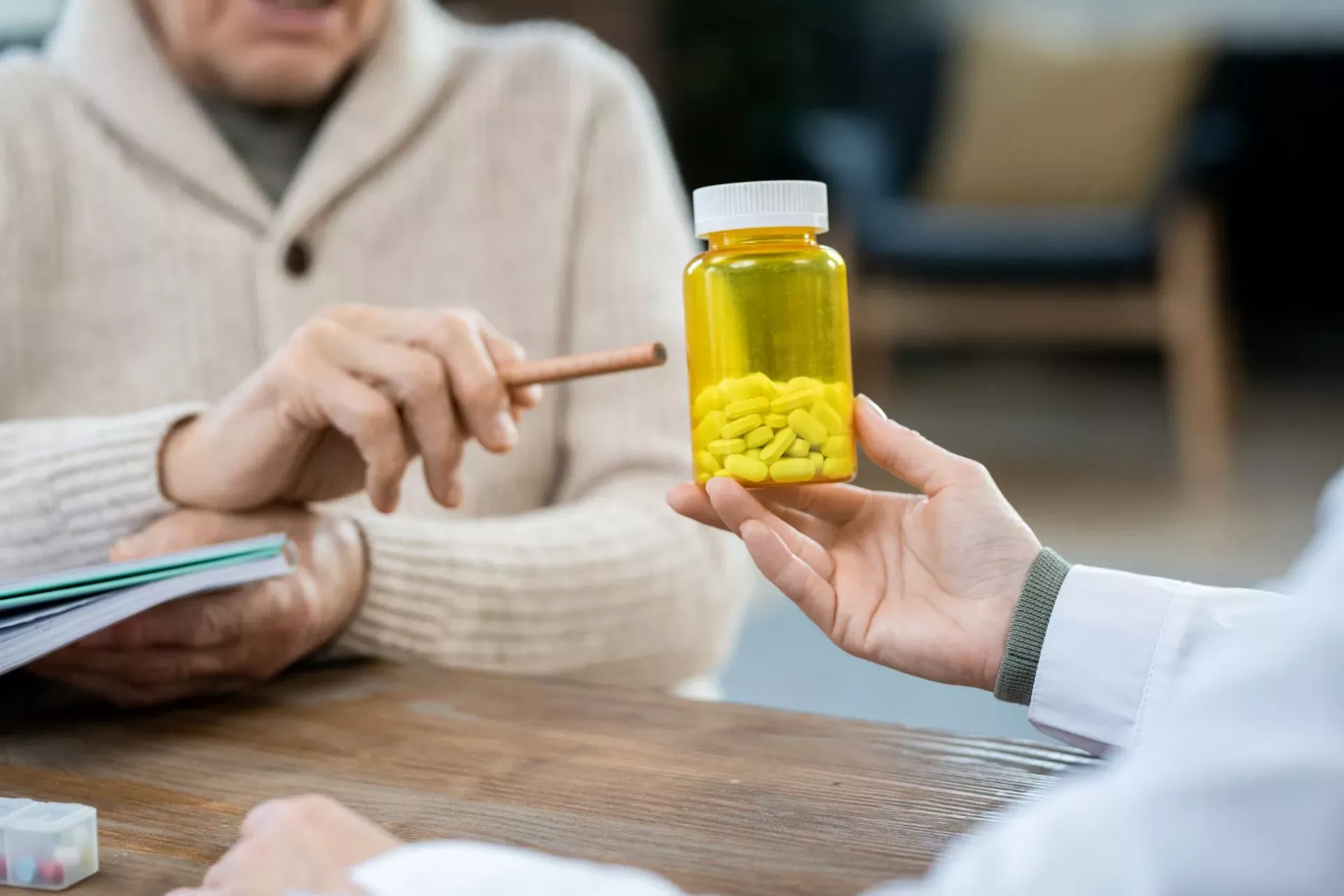 A pharmacist checking a patient’s medicines