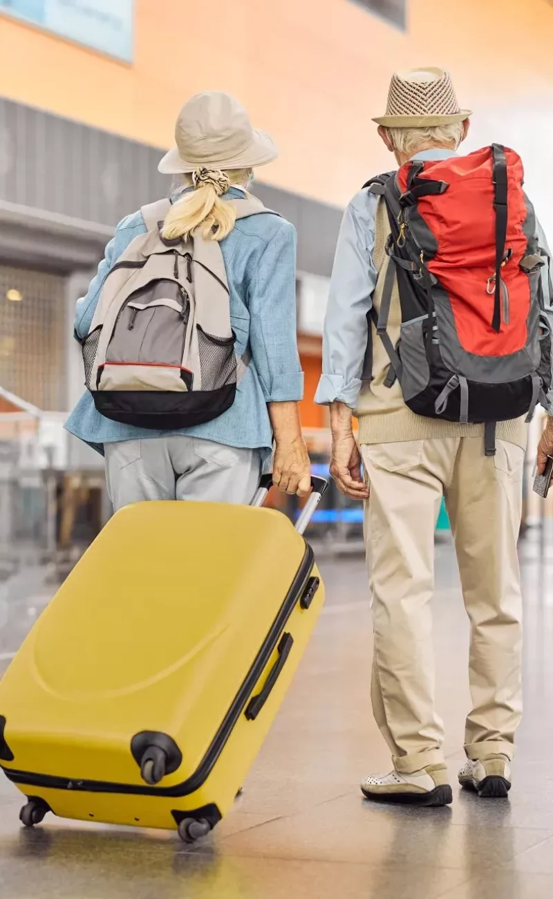 Two travellers at an airport